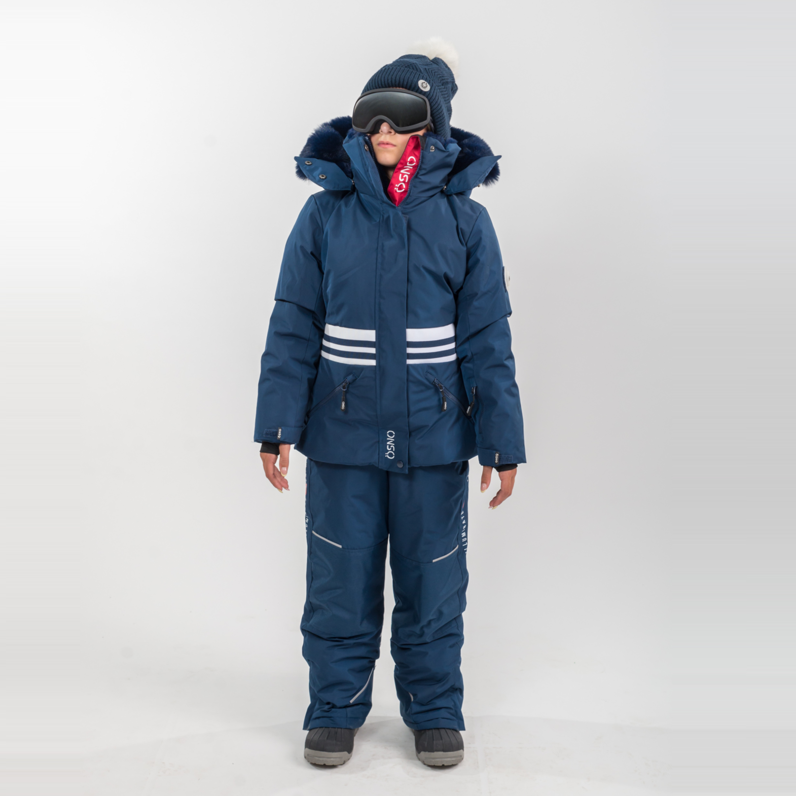 Person wearing a blue snowsuit with white stripes on a white background